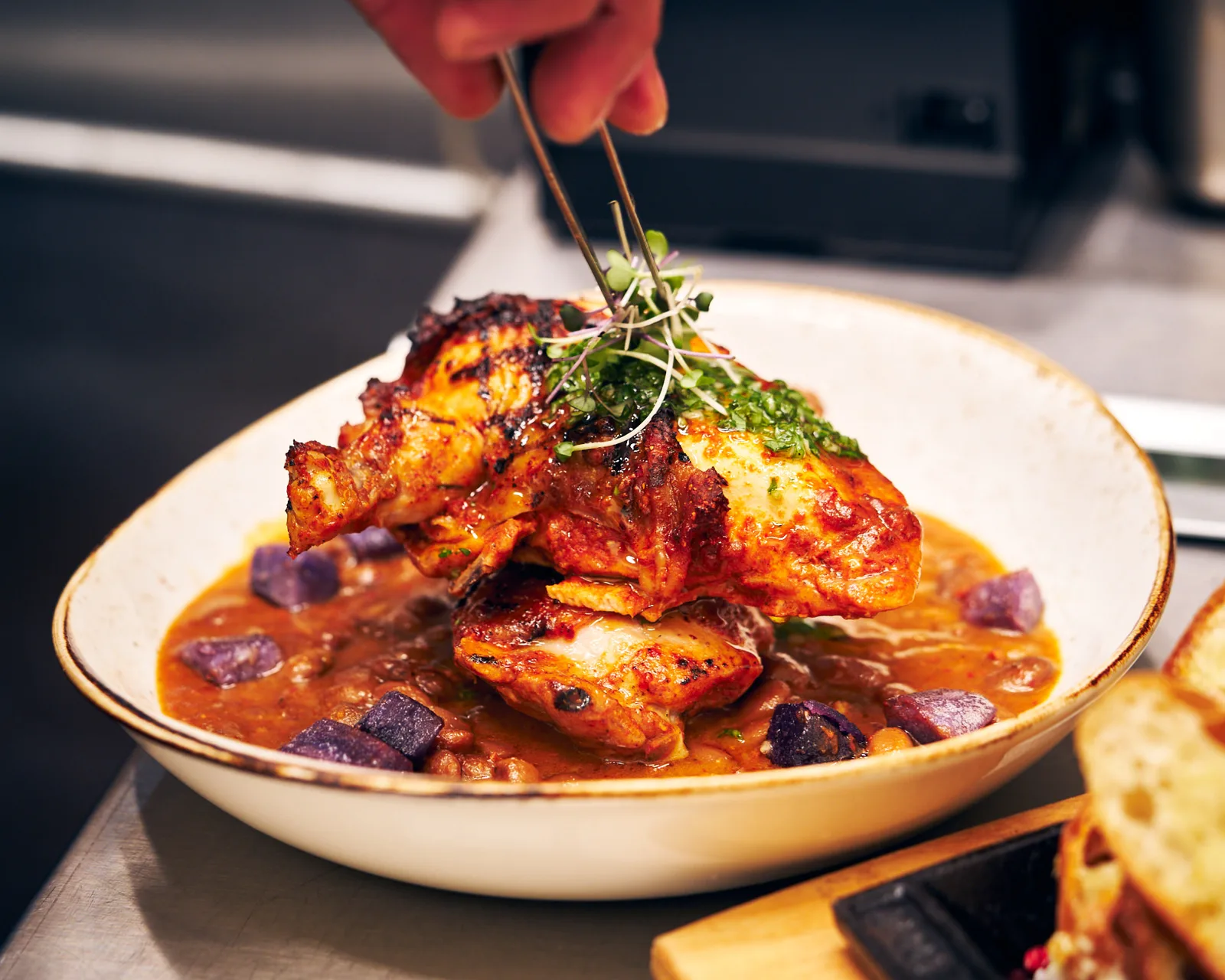 Roasted chicken with stewed beans and purple potatoes at Casa del Toro